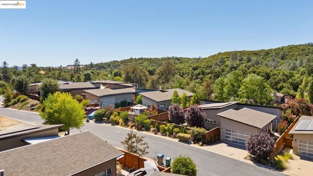 a view of a house with a mountain in the background