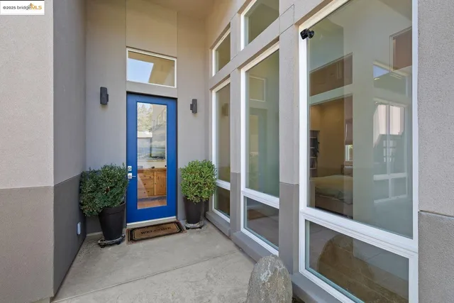 front view of a house with a potted plant
