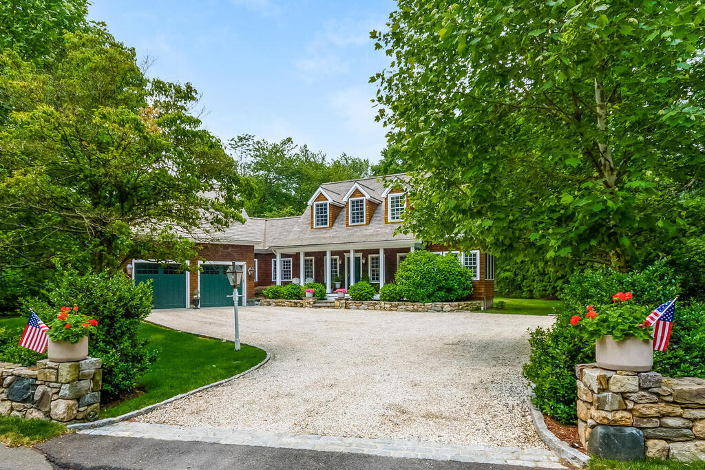 327 Middlesex Road Darien, CT 06820 - Photo 1 of 40 a front view of a house with a garden and trees