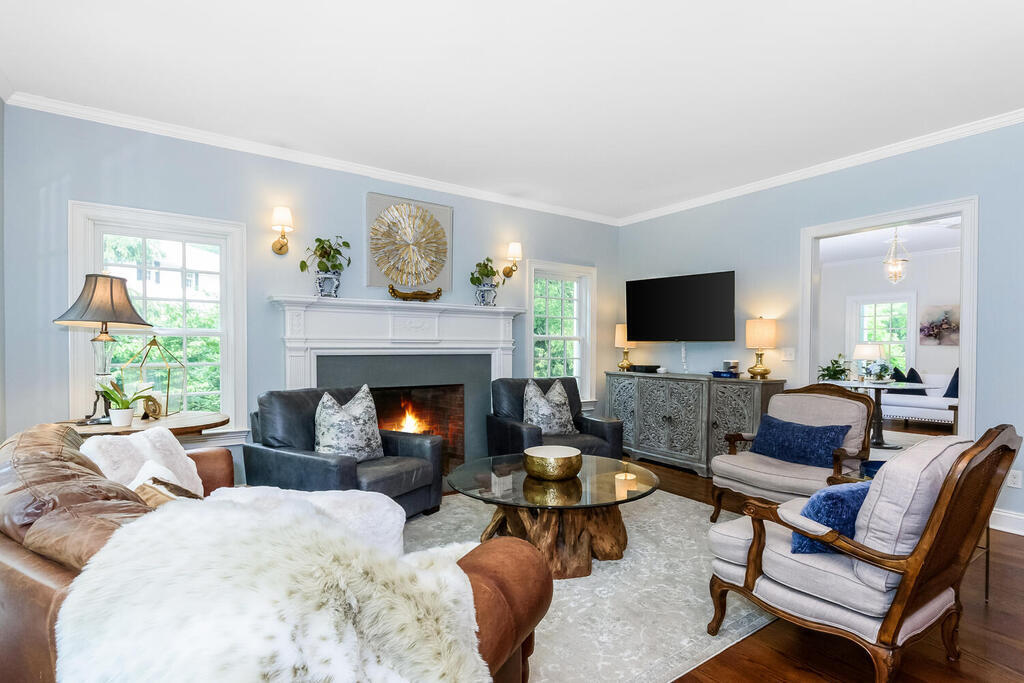 327 Middlesex Road Darien, CT 06820 - Photo 17 of 40 a living room with furniture a fireplace and a flat screen tv