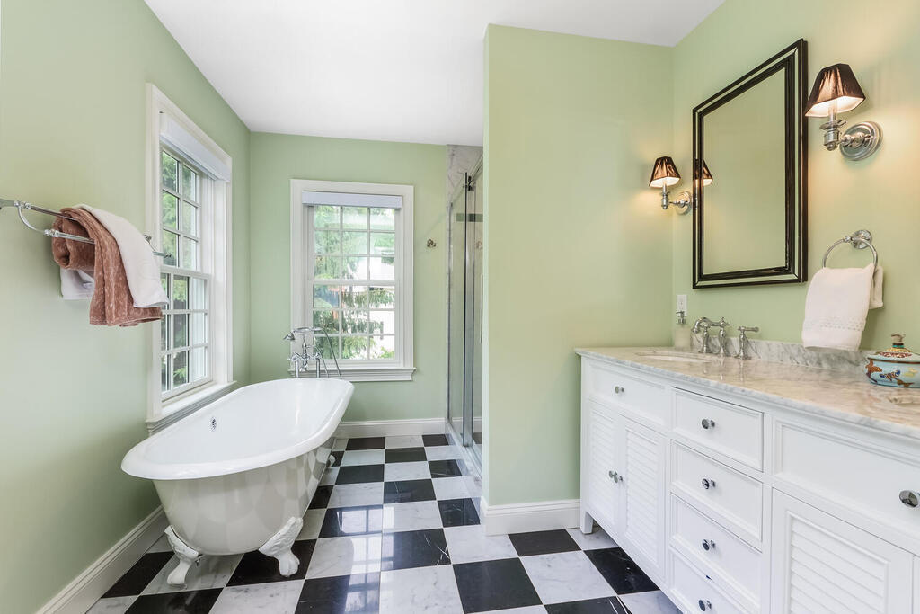 327 Middlesex Road Darien, CT 06820 - Photo 21 of 40 a bathroom with a sink a toilet a mirror and shower