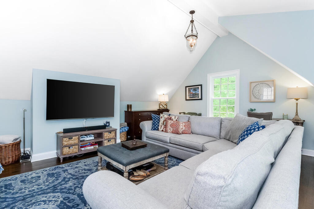 327 Middlesex Road Darien, CT 06820 - Photo 29 of 40 a living room with furniture and a flat screen tv