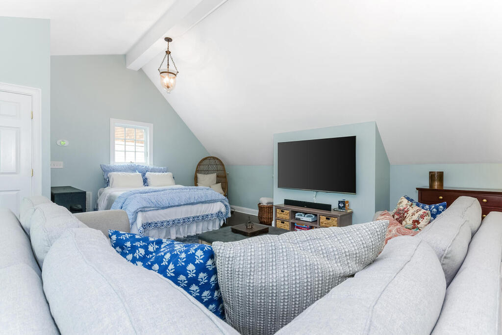 327 Middlesex Road Darien, CT 06820 - Photo 30 of 40 a living room with furniture and a flat screen tv