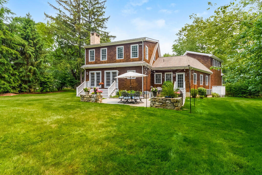 327 Middlesex Road Darien, CT 06820 - Photo 31 of 40 a front view of house with yard and green space