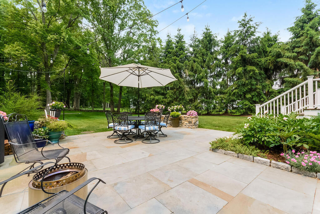 327 Middlesex Road Darien, CT 06820 - Photo 32 of 40 a view of a patio with furniture and a garden