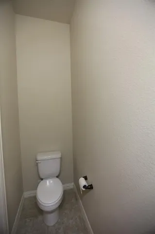 a kitchen with stainless steel appliances granite countertop a sink a stove and a wooden floor