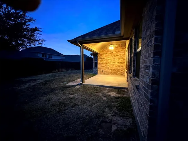 a view of back yard of a house