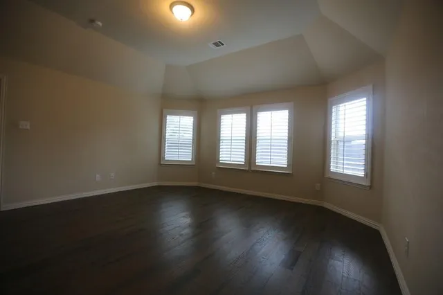 a view of storage and utility room with wooden floor