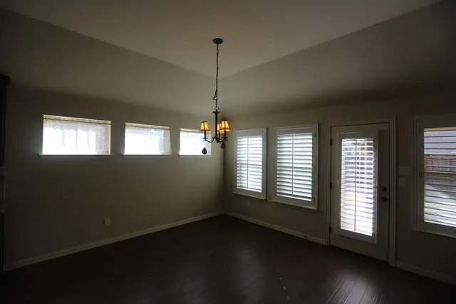 a view of kitchen with granite countertop microwave and stove