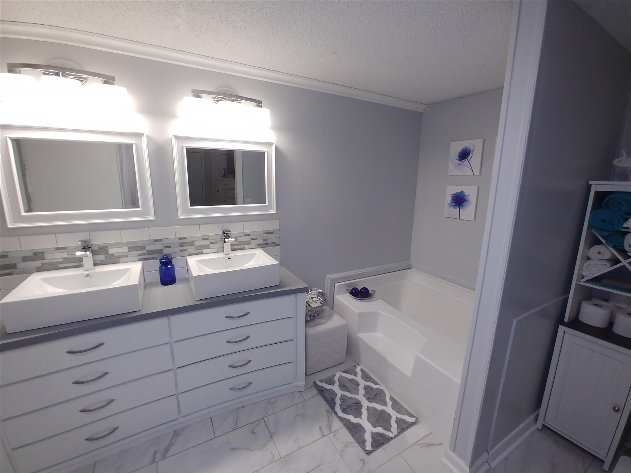 1091 Speck Road Lebanon, TN 37087 - Photo 8 of 15 a bathroom with a tub sink and mirror