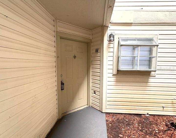 1940 Lake Atriums Circle, Unit 101 Orlando, FL 32839 - Photo 1 of 14 a view of front door of house