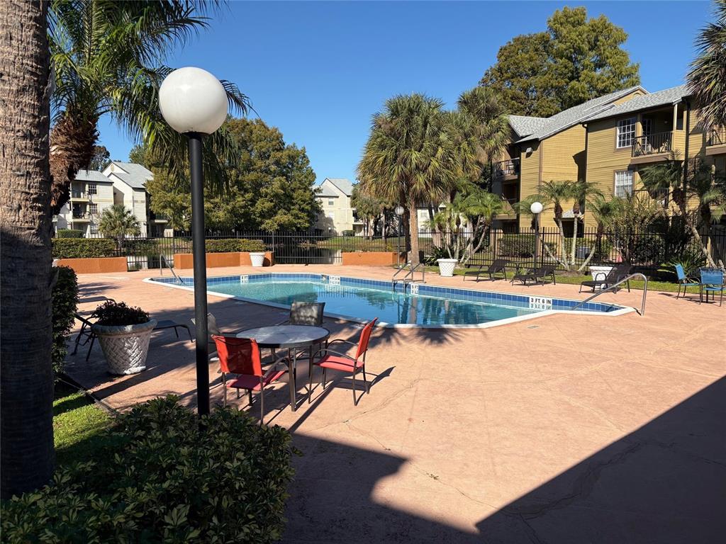 1940 Lake Atriums Circle, Unit 101 Orlando, FL 32839 - Photo 13 of 14 an outdoor space with seating space