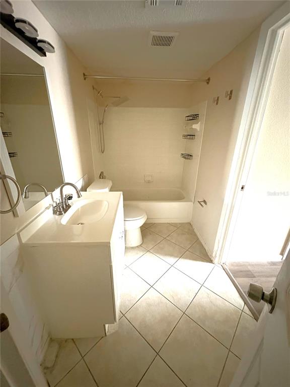 1940 Lake Atriums Circle, Unit 101 Orlando, FL 32839 - Photo 9 of 14 a bathroom with a sink and a mirror