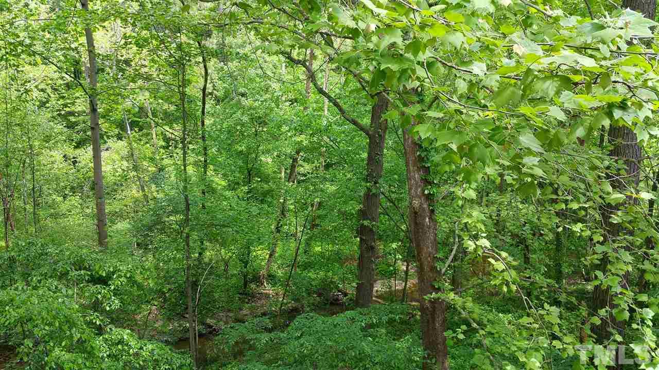 637 Pine Ridge Place, Unit 637 Raleigh, NC 27609 - Photo 2 of 14 a view of a lush green forest
