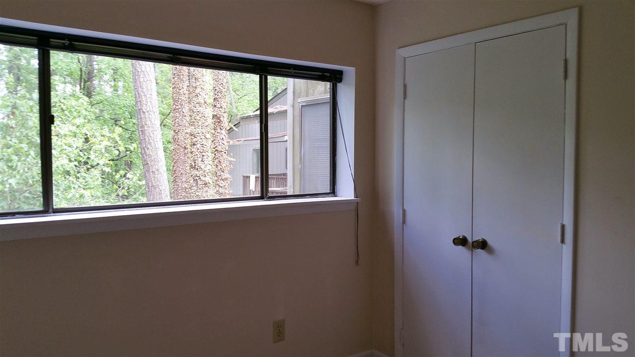 637 Pine Ridge Place, Unit 637 Raleigh, NC 27609 - Photo 14 of 14 an empty room with a window