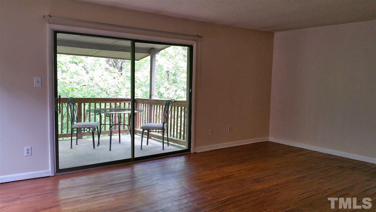 637 Pine Ridge Place, Unit 637 Raleigh, NC 27609 - Photo 3 of 14 a view of a room with wooden floor and walls
