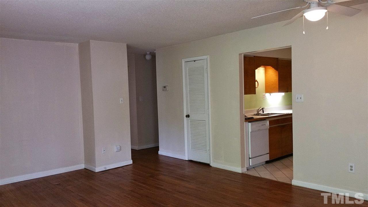 637 Pine Ridge Place, Unit 637 Raleigh, NC 27609 - Photo 7 of 14 a view of a room with wooden floor and window