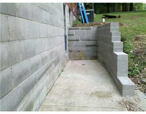 340 Mars Valencia Road Mars, PA 16046 - Photo 14 of 15 Exterior Front. New Retaining wall built with access to basement