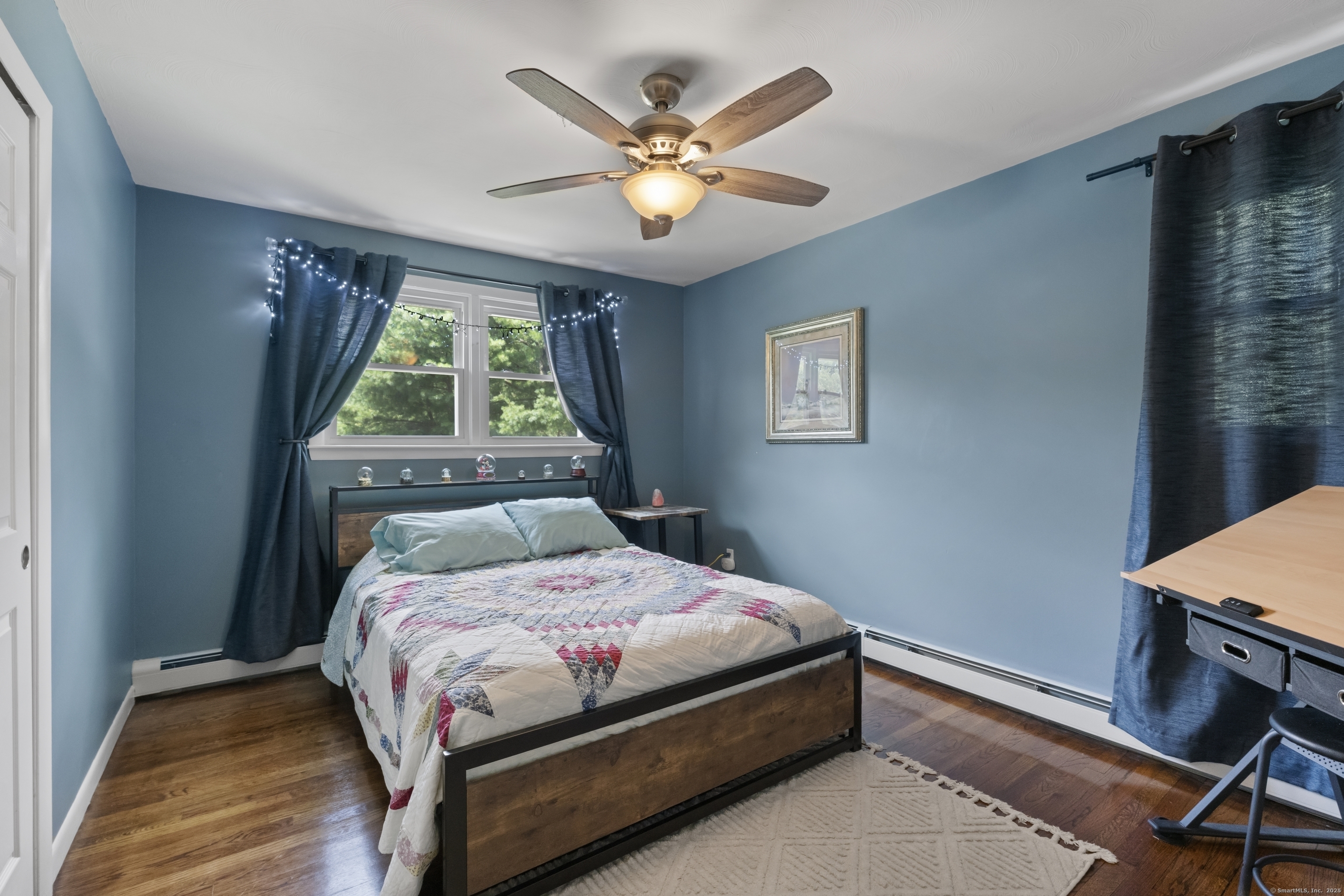 11 Willow Lane Ledyard, CT 06339 - Photo 19 of 39 a bedroom with a bed and a large window