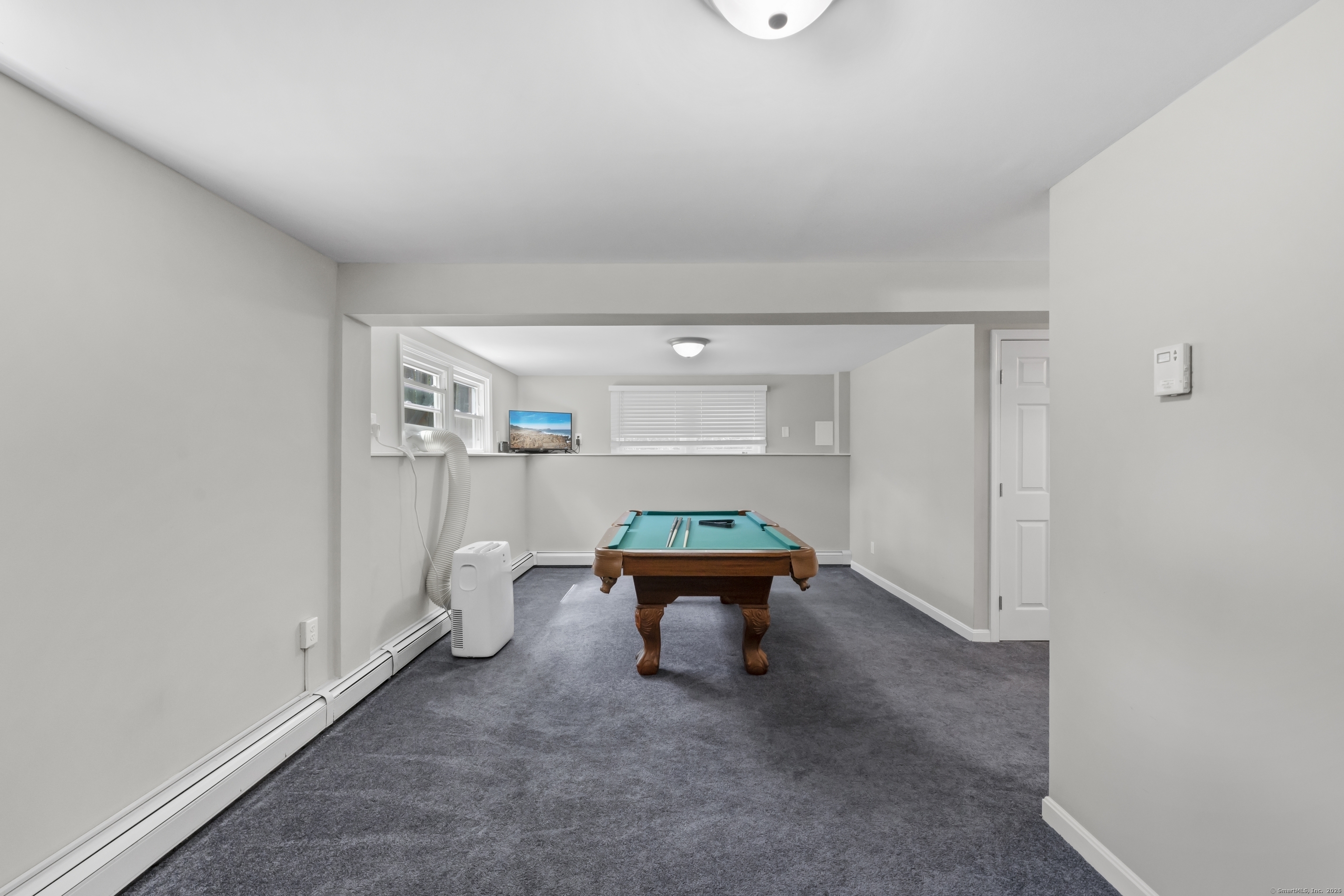 11 Willow Lane Ledyard, CT 06339 - Photo 28 of 39 a room with a chair and white walls