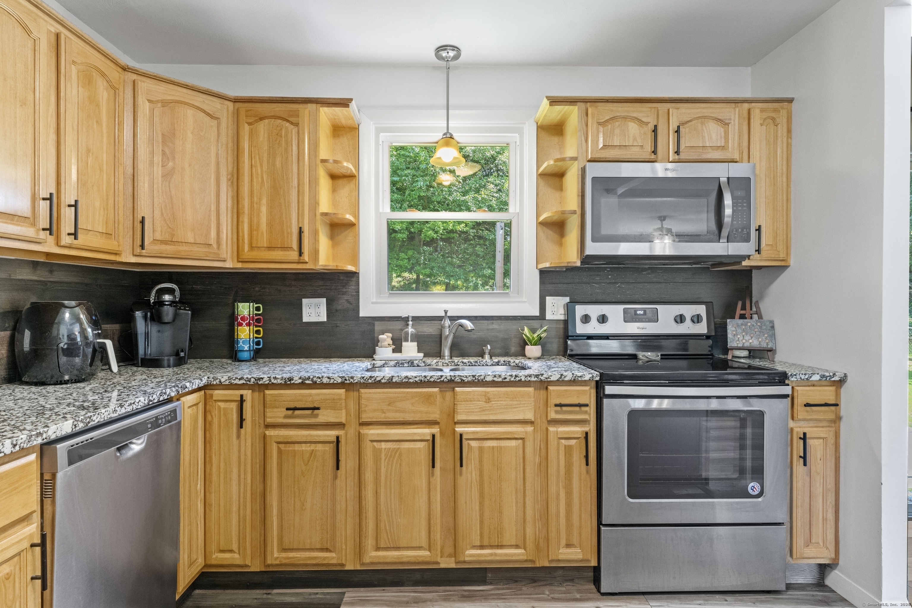 11 Willow Lane Ledyard, CT 06339 - Photo 5 of 39 a kitchen with granite countertop a stove a sink and a granite counter tops
