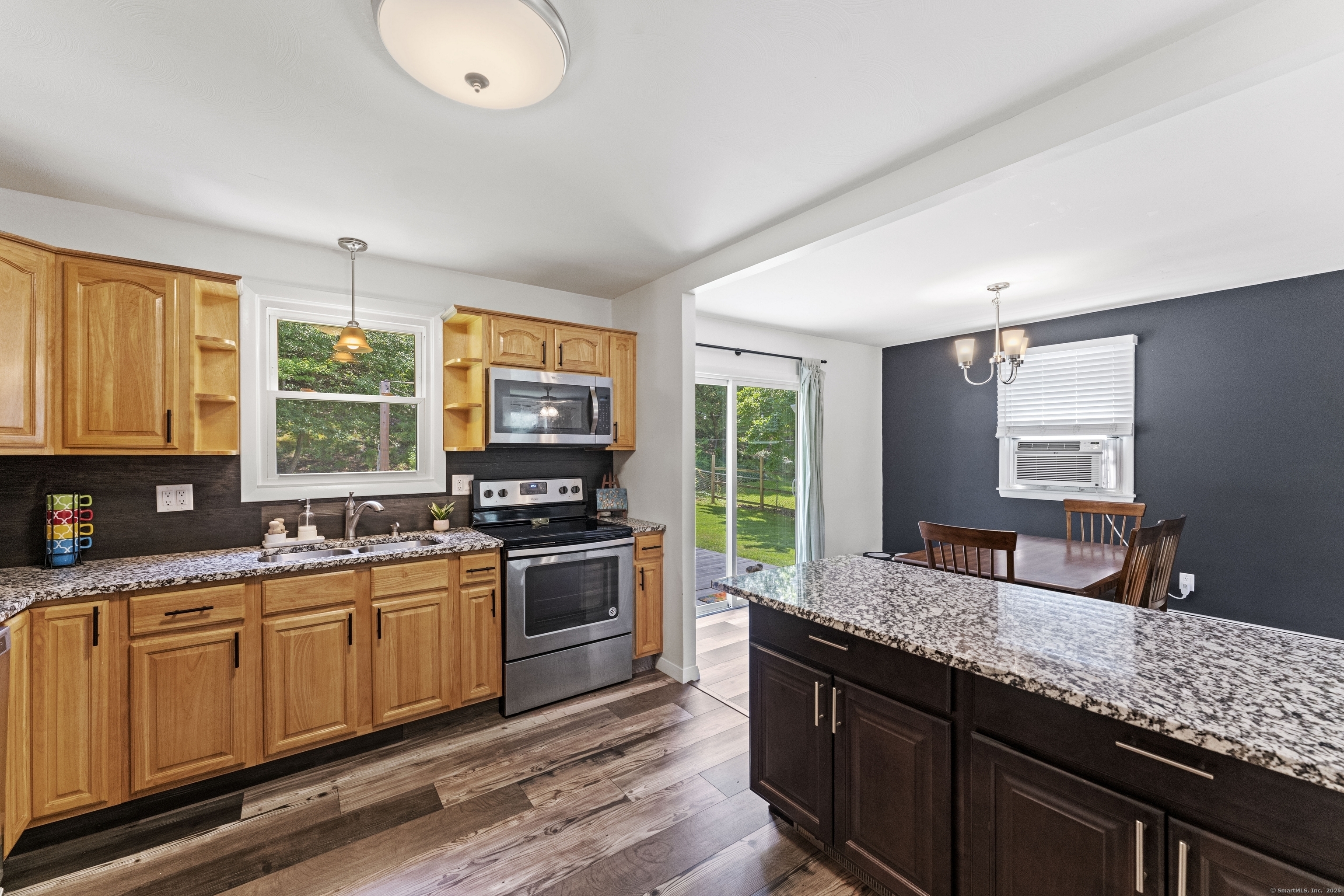 11 Willow Lane Ledyard, CT 06339 - Photo 6 of 39 a kitchen with stainless steel appliances granite countertop a sink stove and window