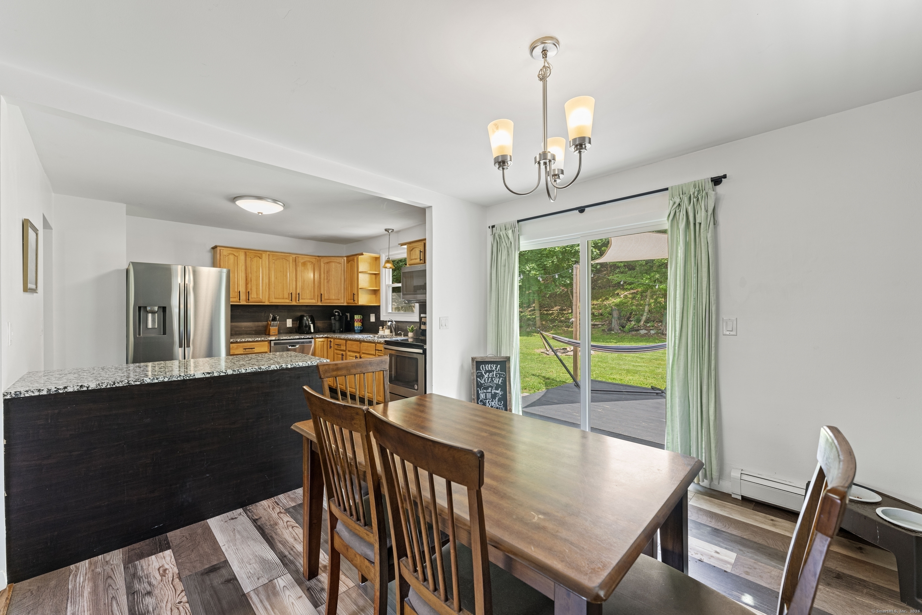 11 Willow Lane Ledyard, CT 06339 - Photo 10 of 39 a view of a dining room with furniture window and wooden floor
