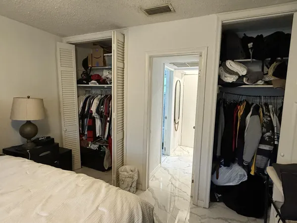 a view of a bedroom and a bedroom