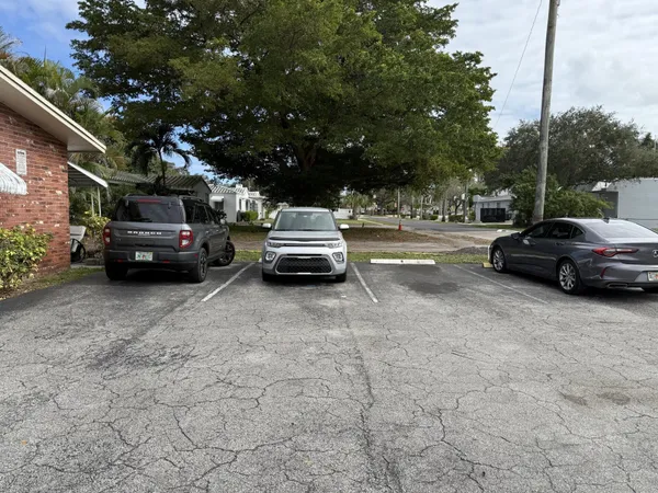 a view of street with parked cars
