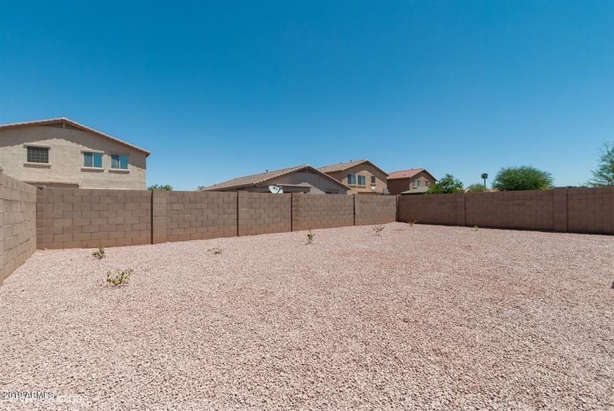 7338 West Darrel Road Laveen, AZ 85339 - Photo 22 of 25 a house view with a wooden fence