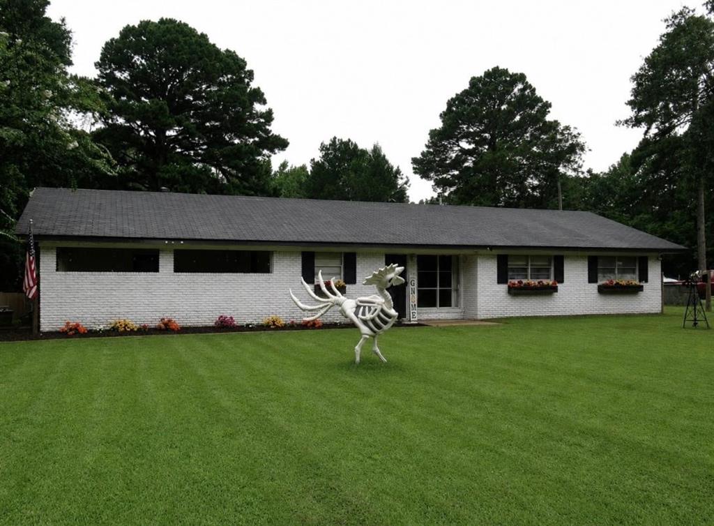 24133 Highway 157 Springhill, LA 71075 - Photo 2 of 19 Single-story residence featuring white brick exterior and a dark shingle roof