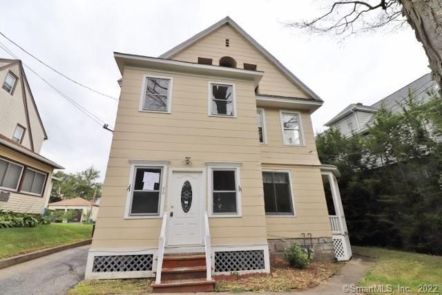 20 Chipman Street Waterbury, CT 06708 - Photo 1 of 1 a front view of a house with a yard