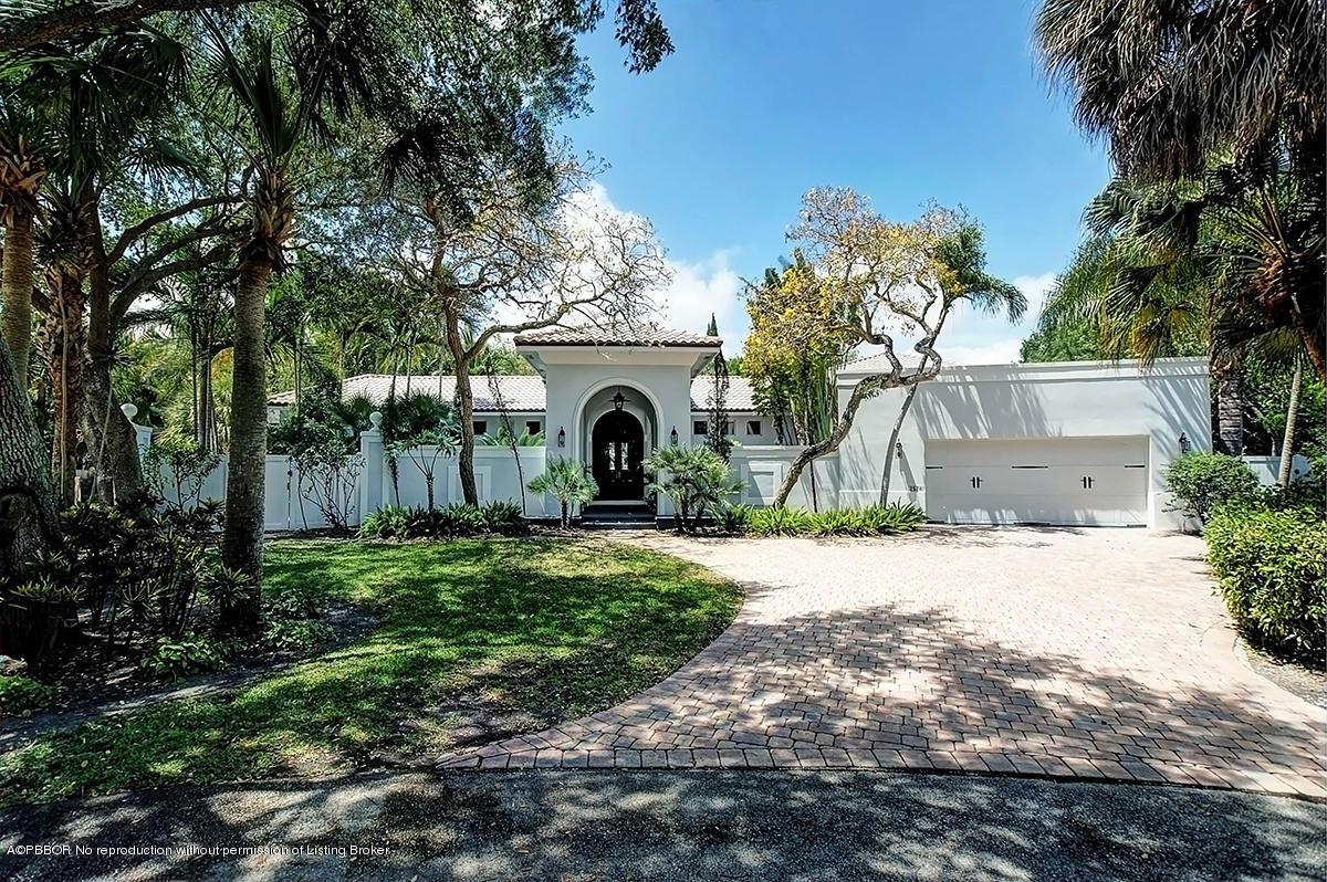 2570 Hampton Bridge Road Delray Beach, FL 33445 - Photo 1 of 40 a front view of a house with garden