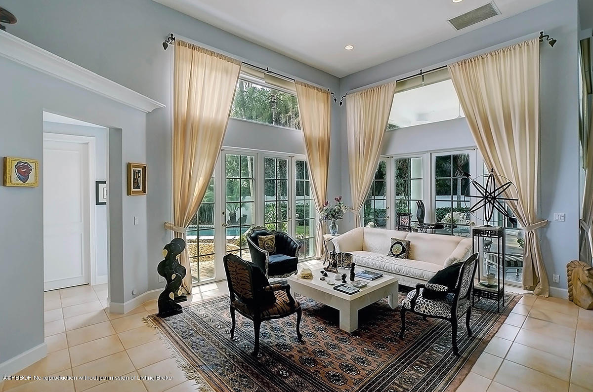 2570 Hampton Bridge Road Delray Beach, FL 33445 - Photo 12 of 40 a living room with furniture and large windows