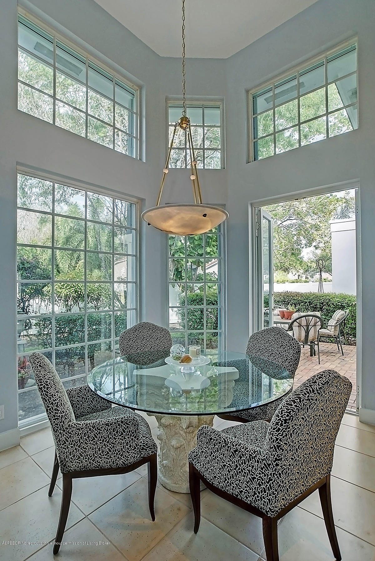 2570 Hampton Bridge Road Delray Beach, FL 33445 - Photo 15 of 40 a dining room with furniture a rug and a large window
