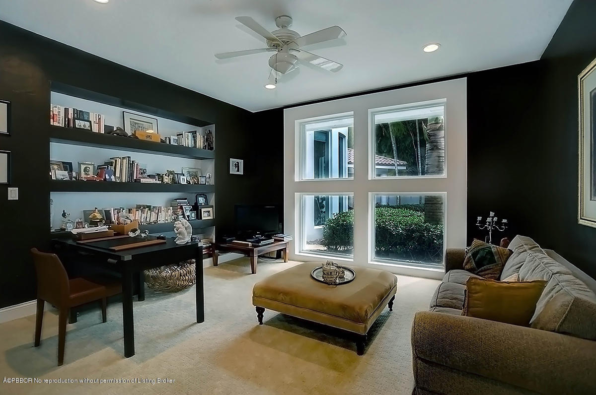 2570 Hampton Bridge Road Delray Beach, FL 33445 - Photo 19 of 40 a living room with furniture lamp and rug