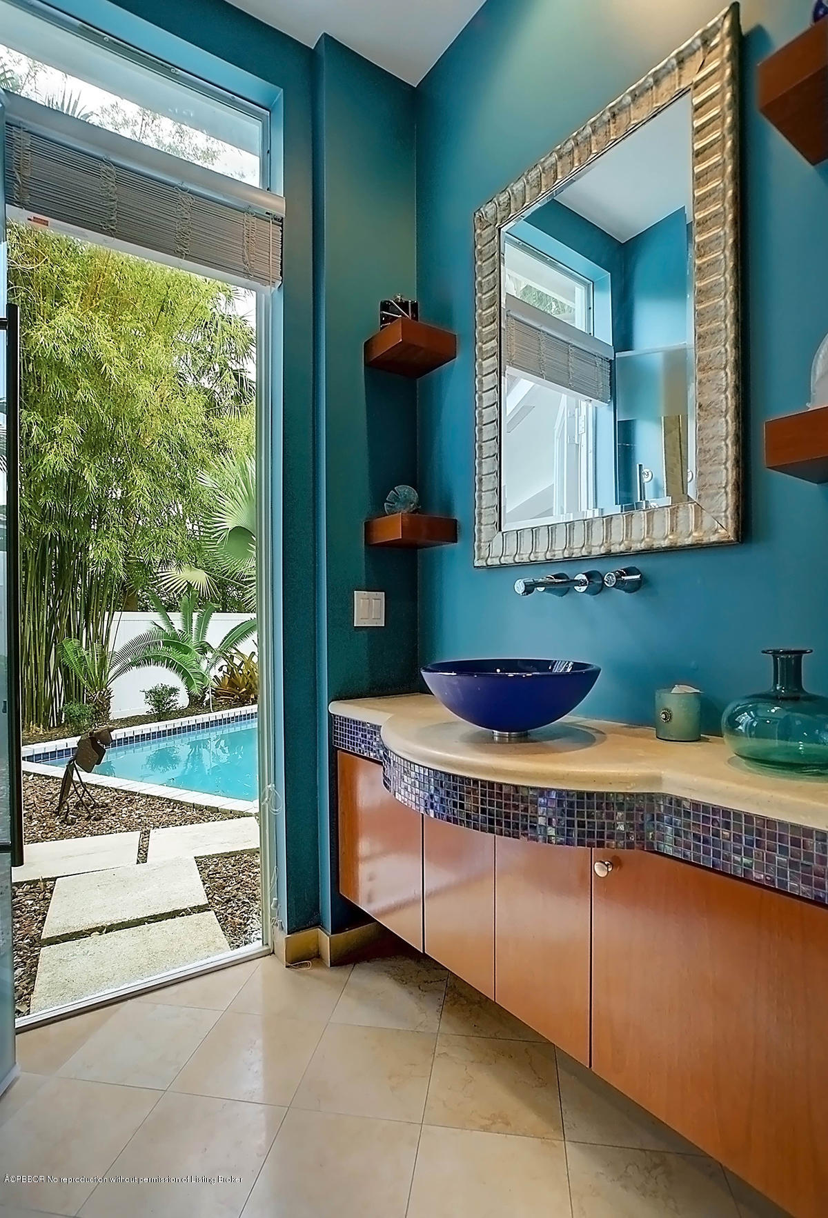 2570 Hampton Bridge Road Delray Beach, FL 33445 - Photo 26 of 40 a bathroom with a tub sink and mirror