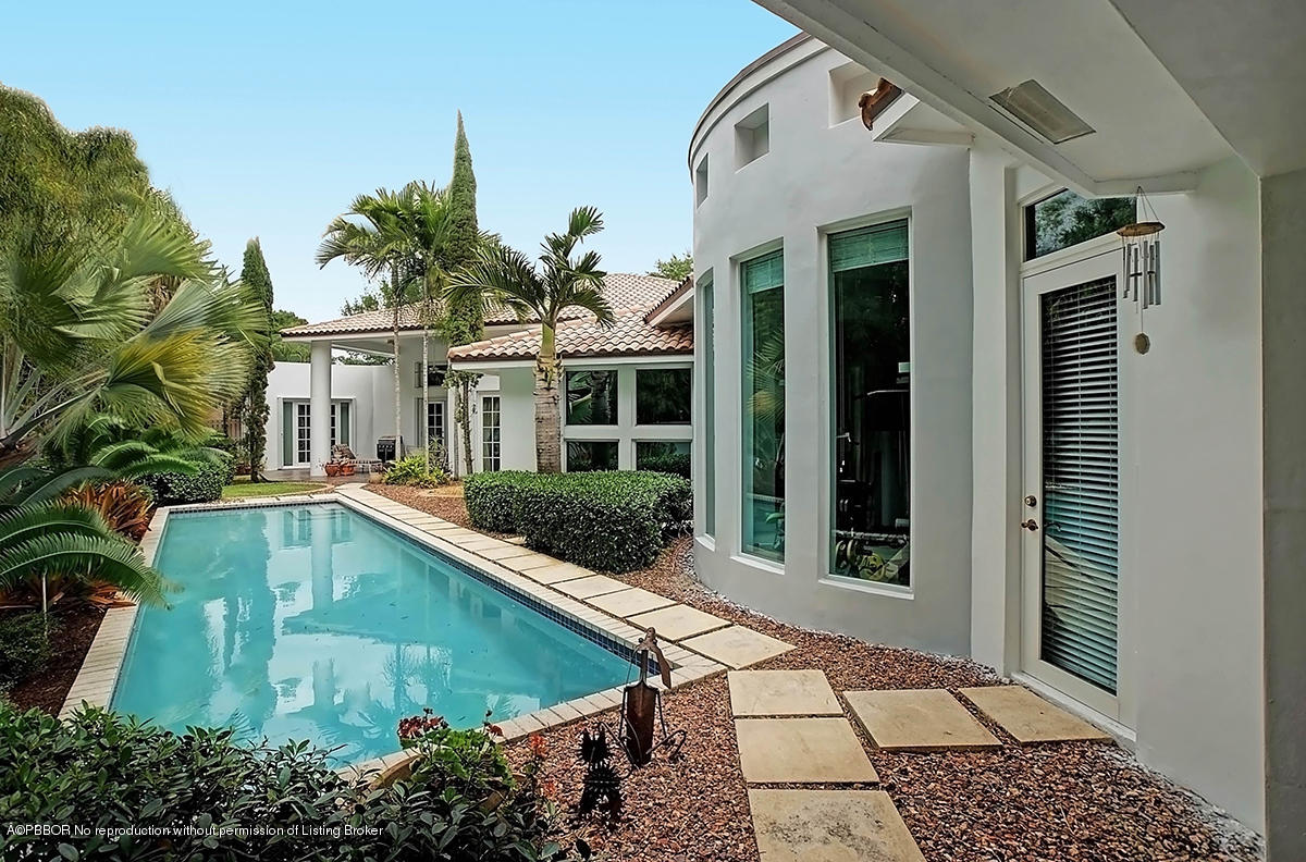 2570 Hampton Bridge Road Delray Beach, FL 33445 - Photo 31 of 40 front view of a house with a yard