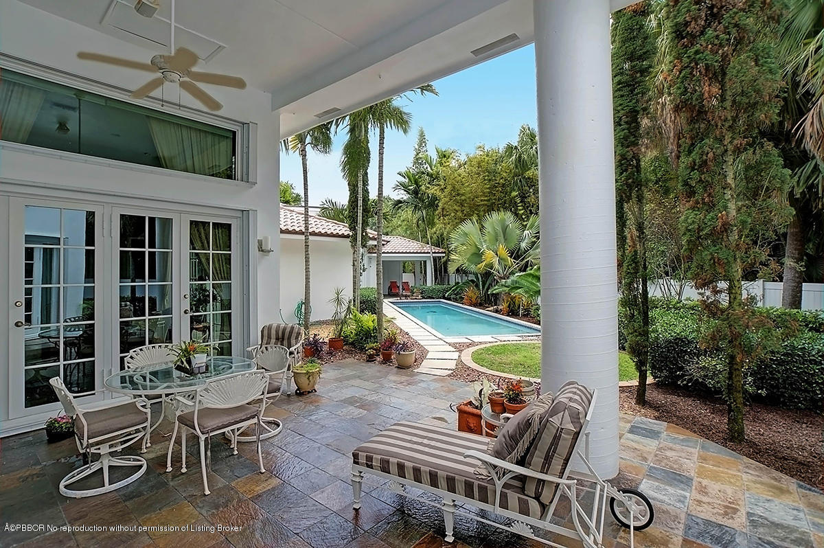 2570 Hampton Bridge Road Delray Beach, FL 33445 - Photo 32 of 40 a backyard of a house with outdoor seating