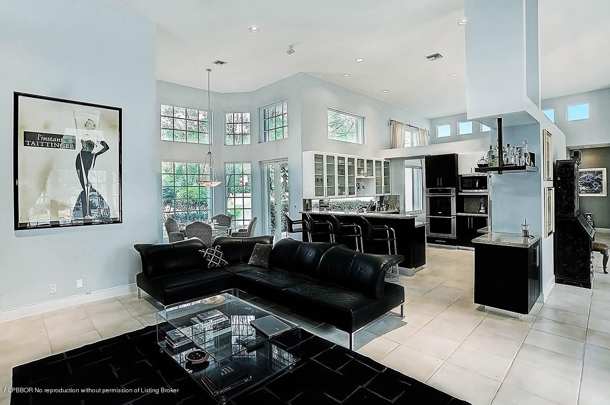 2570 Hampton Bridge Road Delray Beach, FL 33445 - Photo 9 of 40 a living room with furniture and large windows