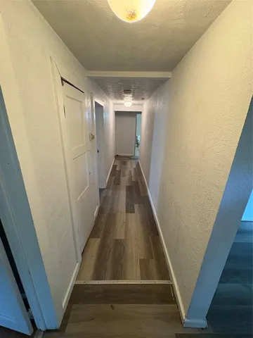 wooden floor in a hall with an entryway