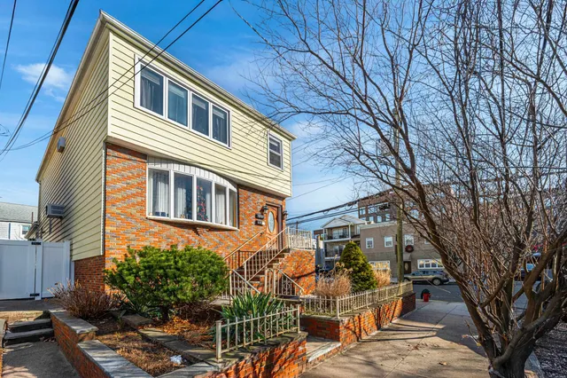 a building view with outdoor seating space