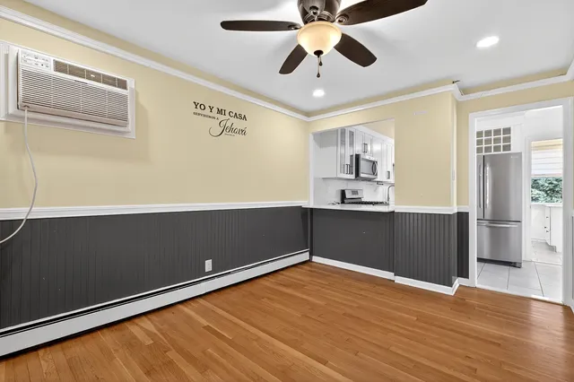 a view of a kitchen with a dishwasher and a refrigerator