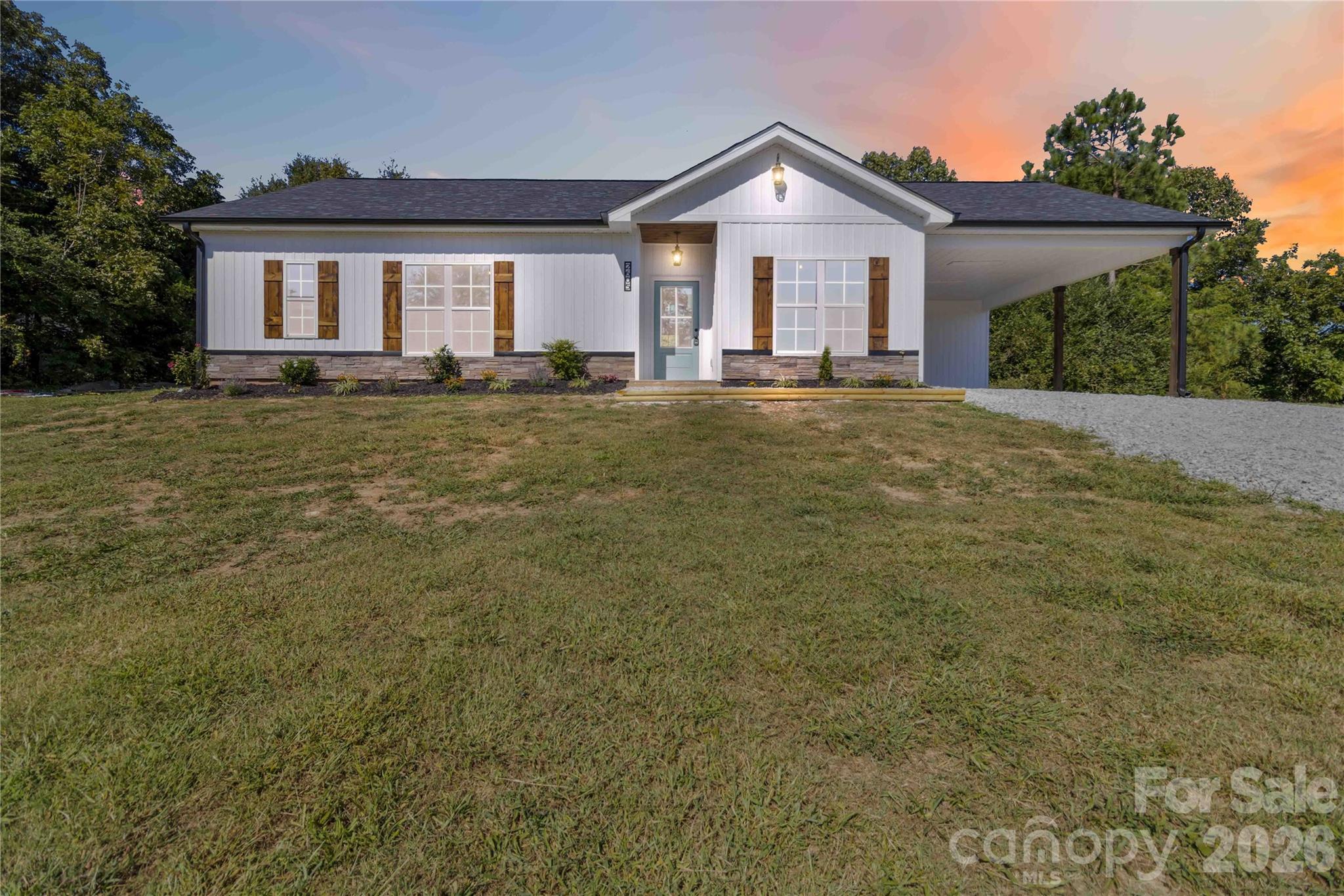 2605 Mt Prospect Road Chester, SC 29706 - Photo 30 of 35 a front view of a house with a yard and garage
