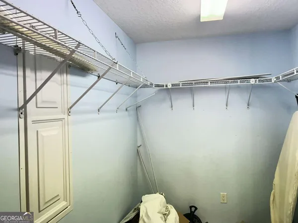 a bathroom with a shower and toilet