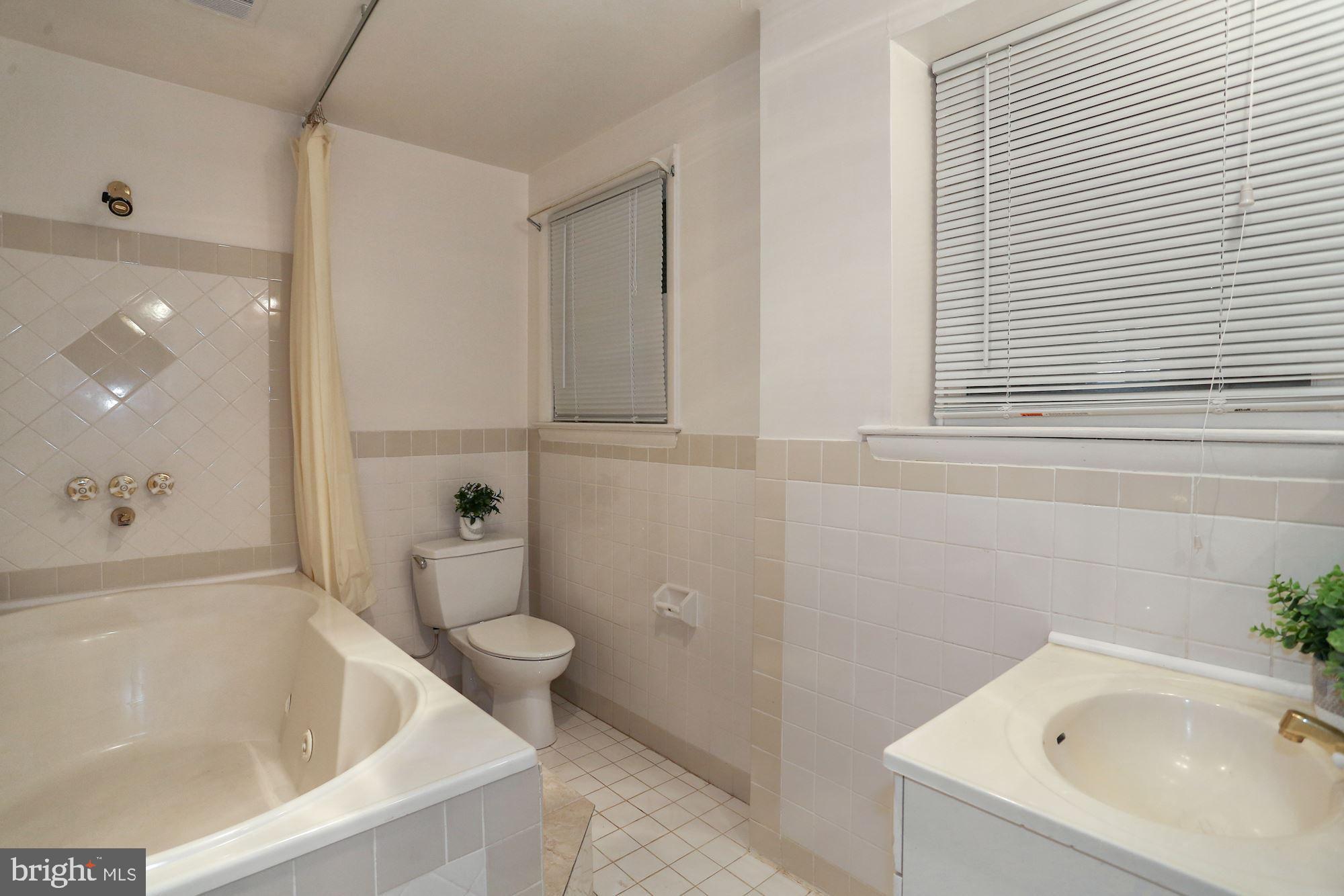 2032 Greenwich Street Falls Church, VA 22043 - Photo 19 of 26 a bathroom with a tub and sink