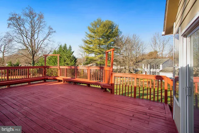 a view of a house with wooden deck