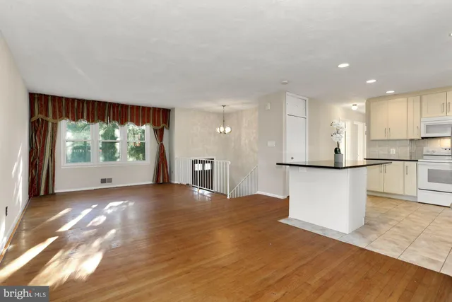 a view of kitchen with furniture and large window