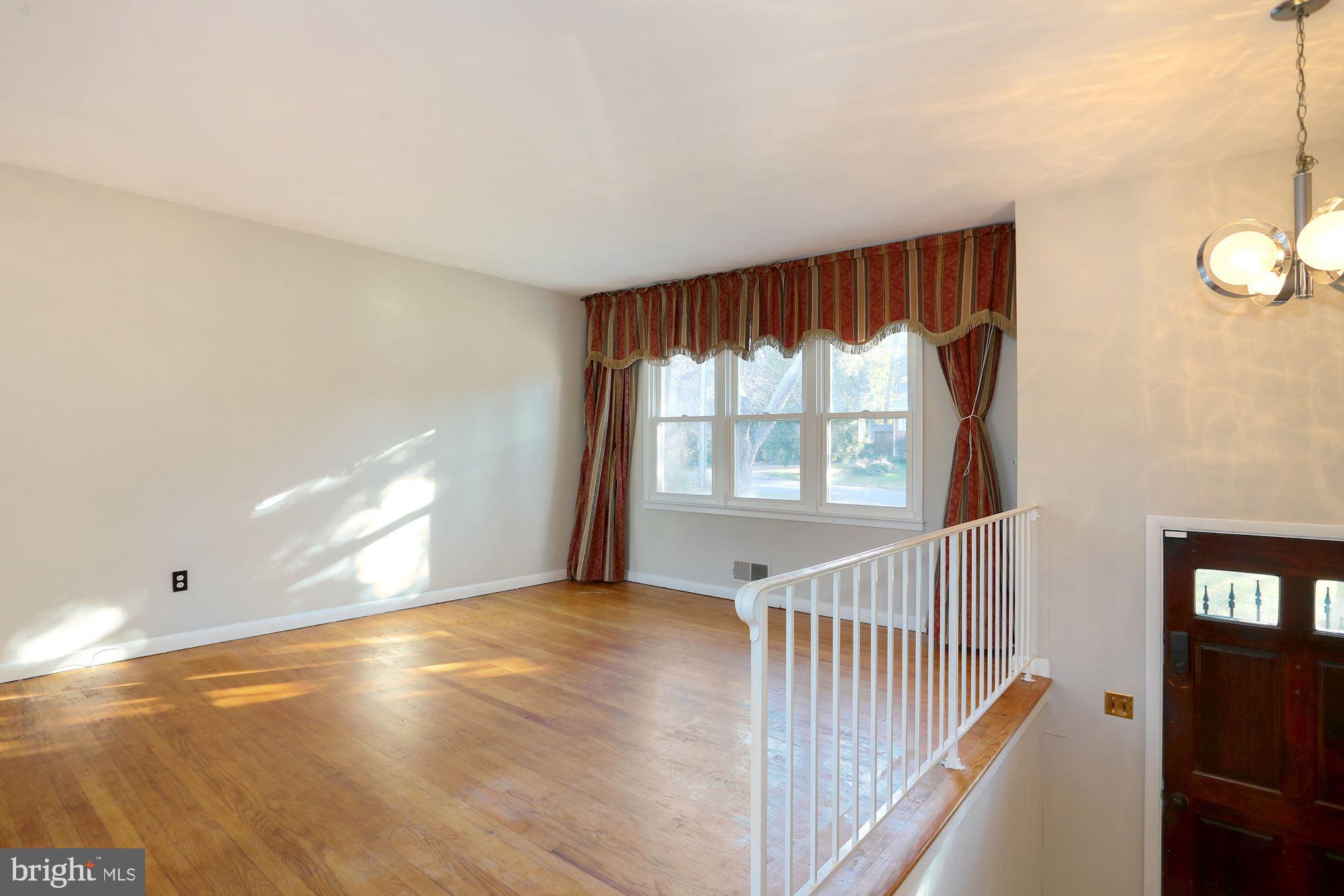 2032 Greenwich Street Falls Church, VA 22043 - Photo 5 of 26 a view of an empty room with wooden floor and a window