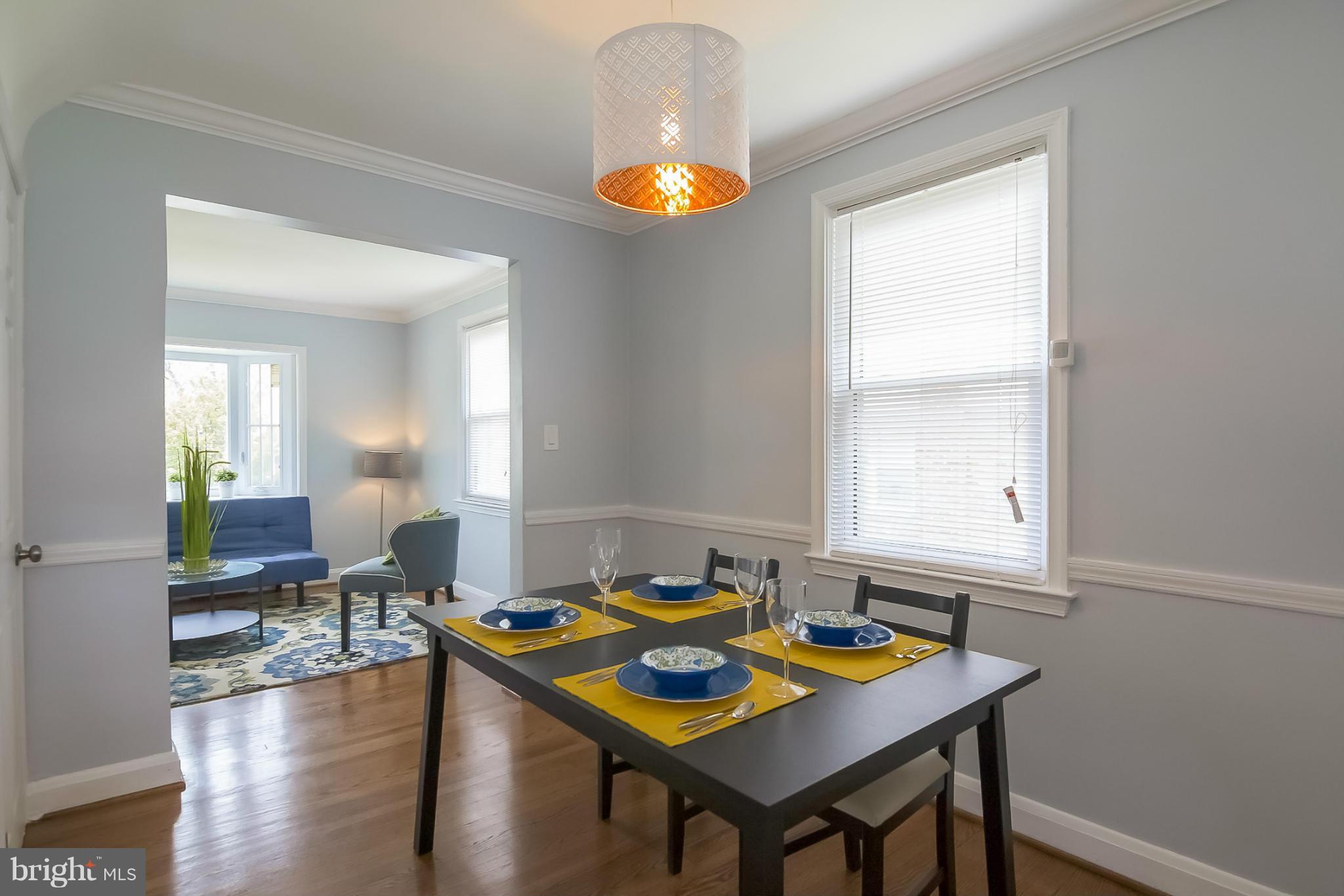 3495 Hillsmere Road Baltimore, MD 21207 - Photo 2 of 19 a view of a dining room with furniture and wooden floor